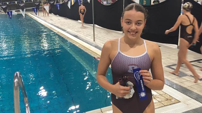 Kaitlyn Di Francesco of Mt Alvernia College after winning a race at the CaSSSA swimming carnival.