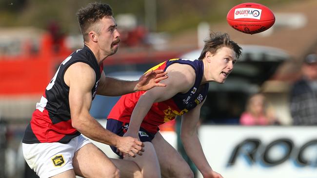 Jake Safstrom and Joshua Wallace fight for the ball. Picture: Hamish Blair