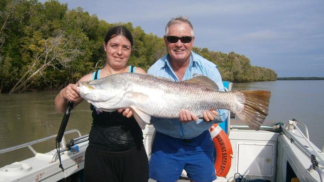 Allan Beale (right) of Darwin's Barra Base with a client who caught a 103cm barra during a guided trip. Picture: Supplied