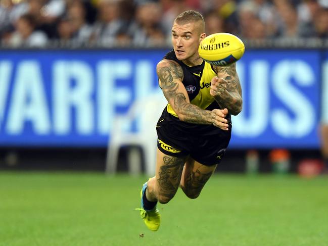 Dustin Martin of the Tigers is seen in action during the Round 2 AFL match between the Richmond Tigers and the Collingwood Magpies at the MCG in Melbourne, Thursday, March 28, 2019. (AAP Image/Julian Smith) NO ARCHIVING, EDITORIAL USE ONLY