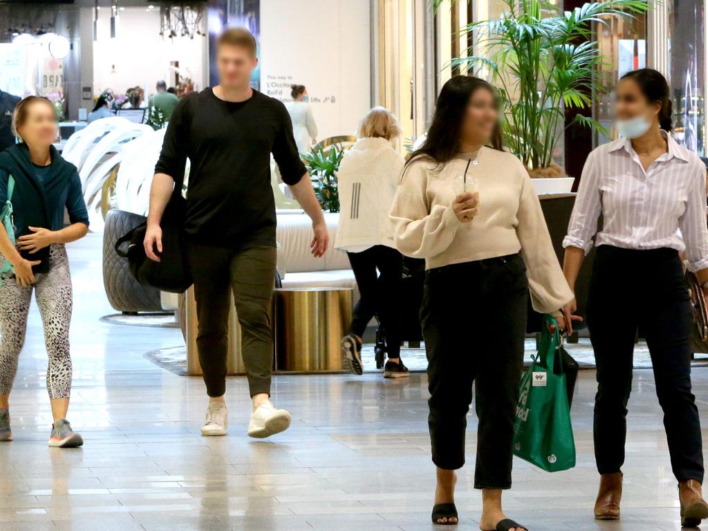 Unmasked shoppers on the Gold Coast yesterday. Picture: Steve Pohlner