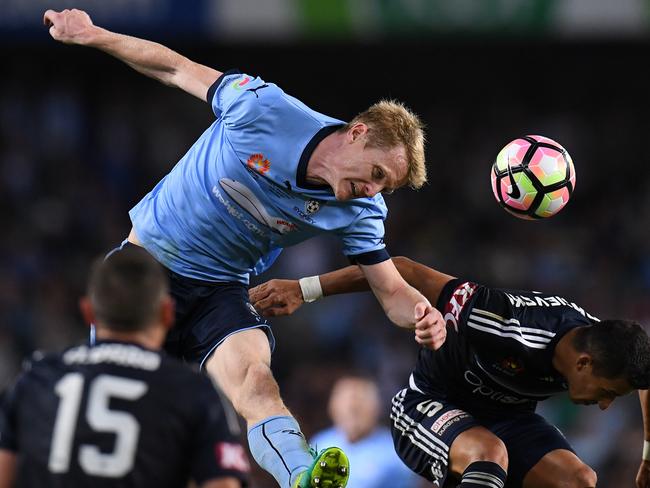 Matt Simon and Daniel Georgievski contest a header during the A-League grand final between Sydney FC and Melbourne Victory. Picture: AAP