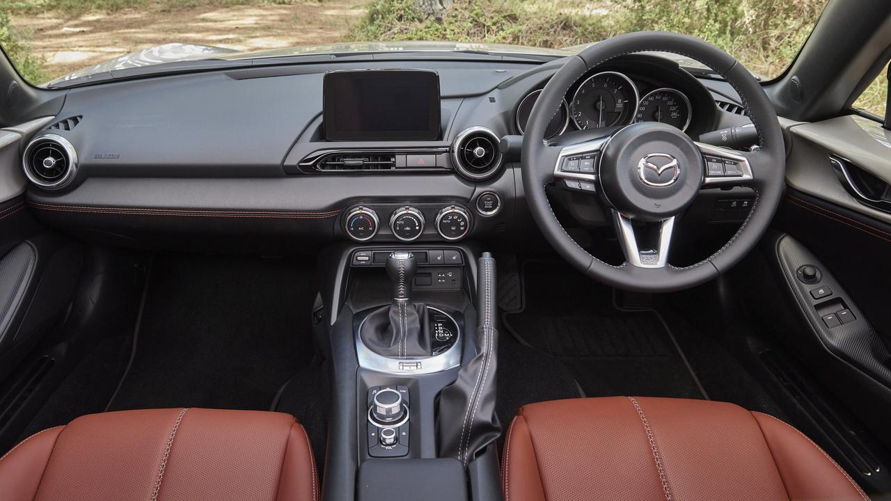 The MX-5’s cabin is a snug fit for bigger drivers..