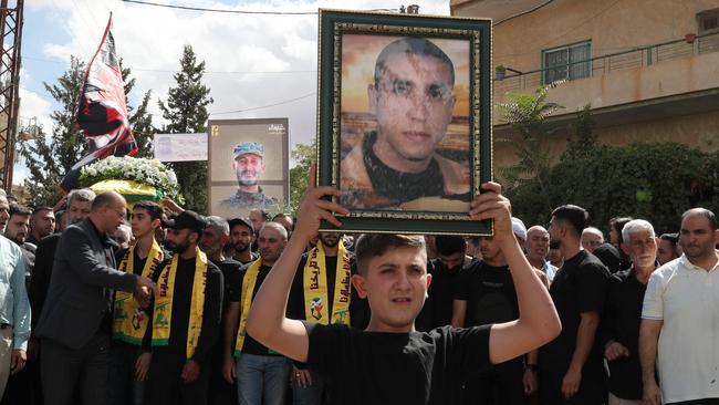 Mourners attend the funeral of a Hezbollah member in the town Chaat in Lebanon's Bekaa Valley. Picture: AFP