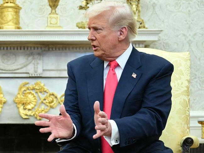 US President Donald Trump meets with Irish Prime Minister Micheal Martin in the Oval Office of the White House in Washington, DC, on March 12, 2025. (Photo by Mandel NGAN / AFP)