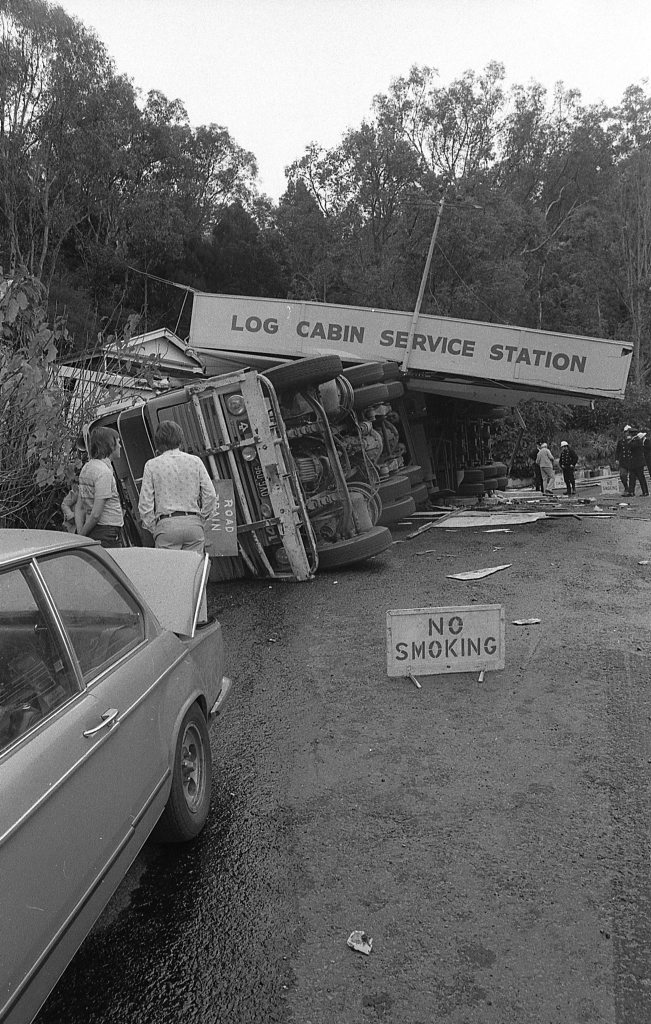 Historic: Toowooba: Accidents Semi-trailer crash at the Log Cabin Service Station on the Toowoomba Range in on 6th September,1978. Three men suffered minor injuries during the crash when the semi-trailer rolled taking out petrol bowsers. A car parked at the service station was also damaged. Photo: Bruce Mackenzie / The Chronicle Neg U869. Picture: Bruce Mackenzie