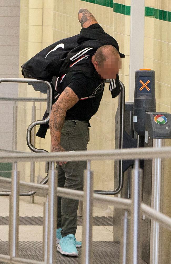 A man forcing his way through the Opal barriers at Central Station yesterday.