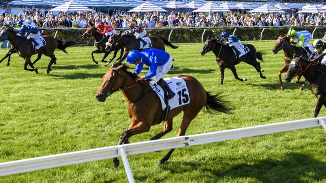 In Secret, with the late Dean Holland aboard, wins the Group 1 Newmarket Handicap at Flemington in March, 2023. Picture: Vince Caligiuri / Getty Images