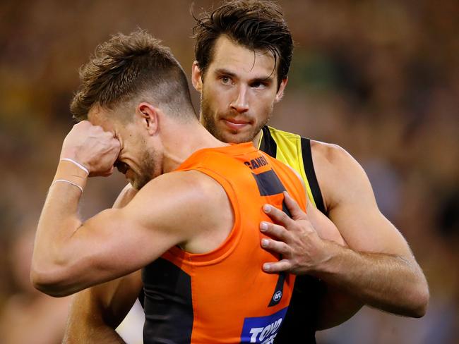 MELBOURNE, AUSTRALIA - SEPTEMBER 23: Alex Rance of the Tigers consoles former Tigers teammate Brett Deledio of the Giants after the Tigers made it through to the grand final in Deledios 250th game during the 2017 AFL Second Preliminary Final match between the Richmond Tigers and the GWS Giants at the Melbourne Cricket Ground on September 23, 2017 in Melbourne, Australia. (Photo by Adam Trafford/AFL Media/Getty Images)