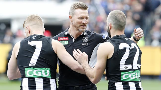 Nathan Buckley with Adam Treloar and Steele Sidebottom. Picture: David Caird