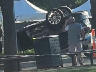 Overturned car outside Haileybury GrammarPICTURE: Supplied