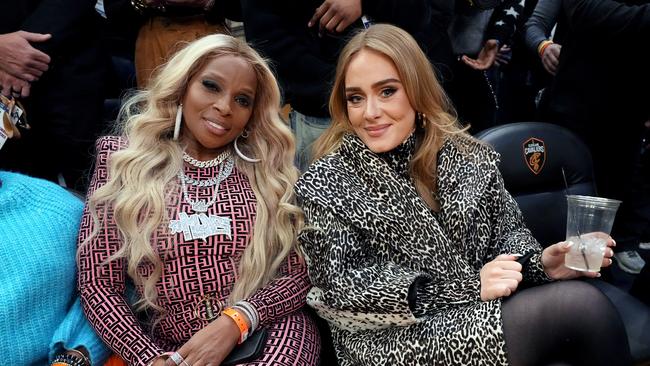 Adele sat next to R&amp;B legend Mary J Blige for much of the game. Picture: Getty