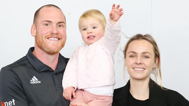 Hawthorn footballer Jarryd Roughead poses with daughter Pippa and wife Sarah.