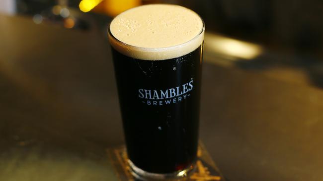 Five of the best Winter beers.  Shambles Brewery, North Hobart.  Bar keep, Will Caught is pictured with  a Barry White (robust Porter), 6%, $8, $13 for a pint.Picture: MATT THOMPSON