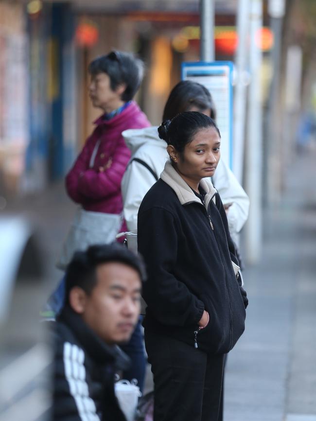 Commuters, unaware of the bus driver strike, wait for buses on Burwood Rd. Picture: John Grainger