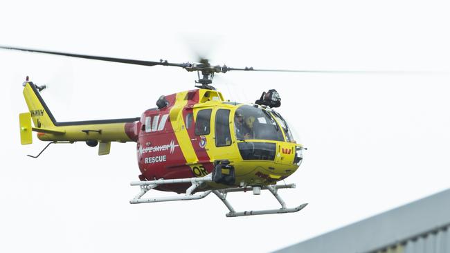 A rescue helicopter returns to base at Caloundra Aerodrome where a charter plane departed on Wednesday afternoon. Picture: Lachie Millard