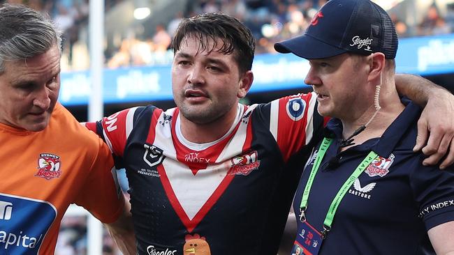 SYDNEY, AUSTRALIA - SEPTEMBER 01: Brandon Smith of the Roosters is helped off the field with an injury during the round 26 NRL match between Sydney Roosters and Canberra Raiders at Allianz Stadium, on September 01, 2024, in Sydney, Australia. (Photo by Cameron Spencer/Getty Images)