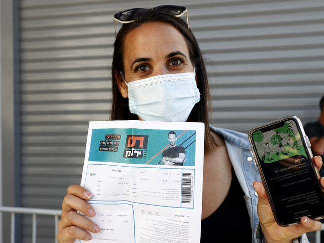 An attendee shows proof of being fully vaccinated upon arrival at Bloomfield Stadium in Tel Aviv. Picture: AFP