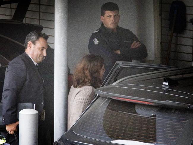 Police escort Erin Patterson into Wonthaggi Police station after her arrest. Picture: David Caird