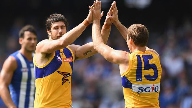 Josh Kennedy celebrates a goal with Jamie Cripps.