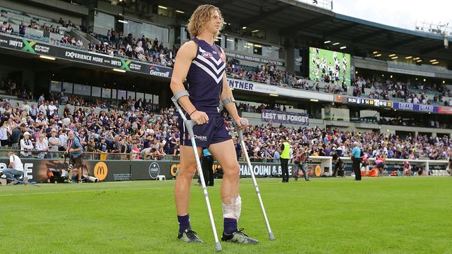 Nat Fyfe on crutches earlier this season.