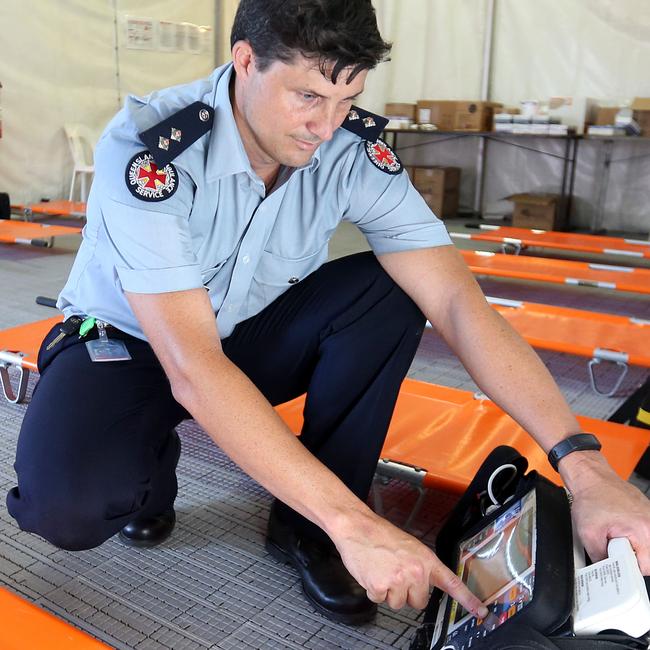 QAS Officer in Charge (Coolangatta) Justin Payne on the job. Picture: Richard Gosling