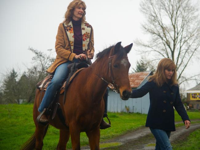 Both nominees ... Laura Dern (on horse) and Reese Witherspoon in a scene from film Wild. Picture: Supplied