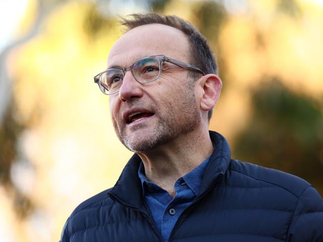 MELBOURNE, AUSTRALIA - MAY 03: Adam Bandt, leader of the Greens speaks to media in the seat of Wills at Brunswick East Primary School on May 03, 2025 in Melbourne, Australia. Australians headed to the polls on Saturday for the 2025 federal election, where all 150 seats in the House of Representatives and 40 of 76 Senate seats are up for grabs. This election is especially consequential due to a tightly contested race, with cost-of-living pressures, affordable housing, and energy policy dominating the campaign. Though most polls indicate a narrow Labor victory against the Liberal-National coalition, the result could also lead to a hung parliament, reflecting the growing influence of independents and minor parties, and potentially reshaping the balance of power in Australia in the years ahead. (Photo by Morgan Hancock/Getty Images)