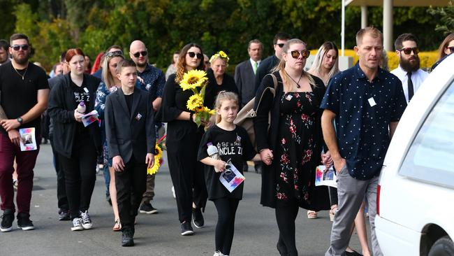 Friends and family follow the hearse after the funeral of Zac Jones. PHOTO: Adam Head