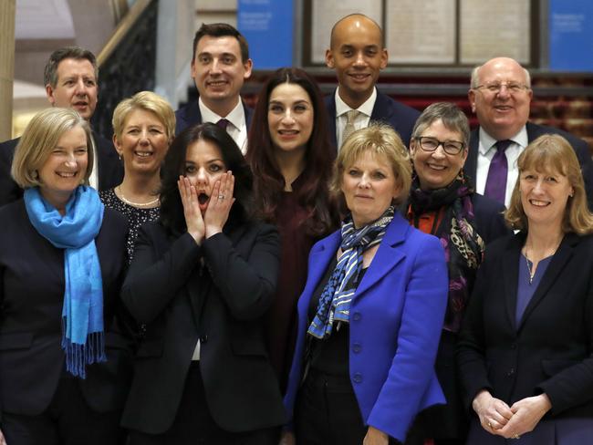 Eleven British lawmakers who have joined new political party 'The Independent Group' pose for a photograph after a press conference in Westminster in London, Wednesday, Feb. 20, 2019. Cracks in Britain's political party system yawned wider Wednesday, as three pro-European lawmakers - Soubry, Allen and Wollaston - quit the governing Conservatives to join a newly formed centrist group of independents who are opposed to the government's plan for Britain's departure from the European Union. (AP Photo/Alastair Grant)