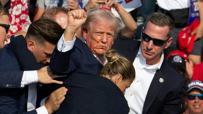 Donald Trump is taken off the stage after an assassination bid in Butler, Pennsylvania. Picture: AFP.