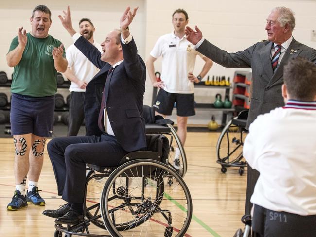 Prince William, Duke of Cambridge celebrates after the basket ball he threw from a wheel chair went into the hoop during a visit to the defence medical rehabilitation centre. Picture: Richard Pohle - WPA Pool/Getty Images