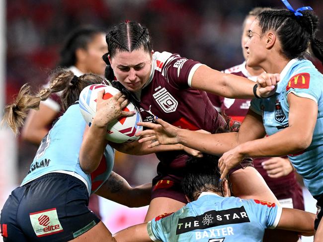 BRISBANE, AUSTRALIA - MAY 16: Romy Teitzel of Queensland takes on the defence during game one of the 2024 Women's State of Origin series between Queensland and New South Wales at Suncorp Stadium on May 16, 2024 in Brisbane, Australia. (Photo by Bradley Kanaris/Getty Images)