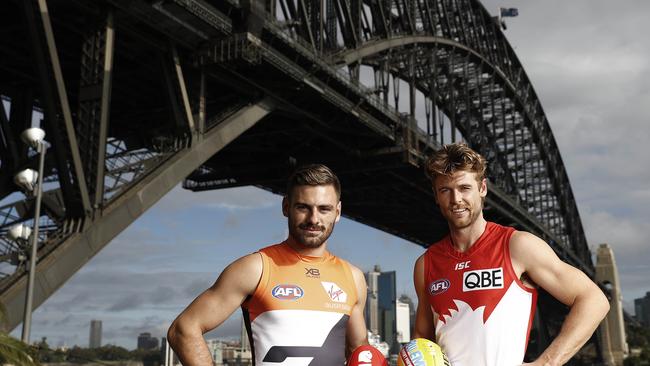 GWS midfielder Stephen Coniglio and Sydney defender Dane Rampe ahead of this weekend’s crucial Sydney derby. Picture: Ryan Pierse/Getty Images.