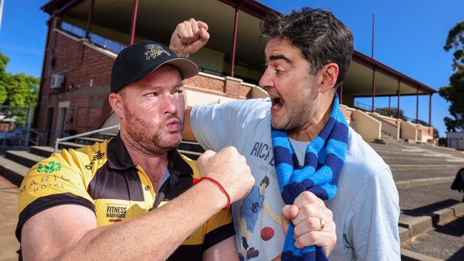 Sledge by sledge they kinda stand together … Glenelg No. 1 ticket holder Andrew 'Cosi' Costello and Sturt tragic David Penberthy. Picture: Russell Millard Photography