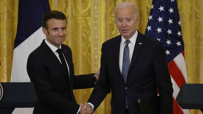 US President Joe Biden and French President Emmanuel Macron shake hands after a joint press conference in the East Room of the White House in Washington. Picture: AFP