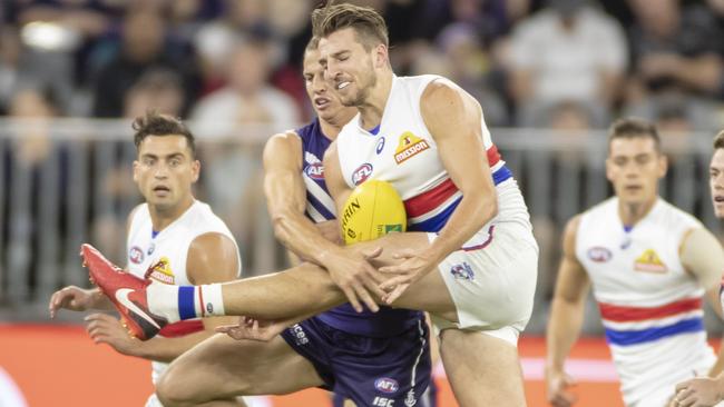 Marcus Bontempelli is tackled by Nat Fyfe.