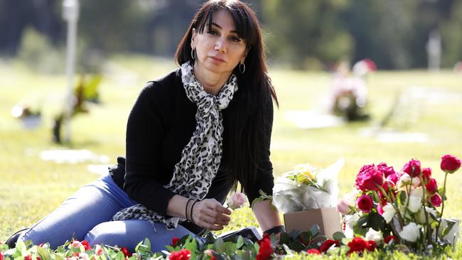 Tanya Petrus at the graveside of her daughter Merna Aprem who died in care. Picture: Jonathan Ng