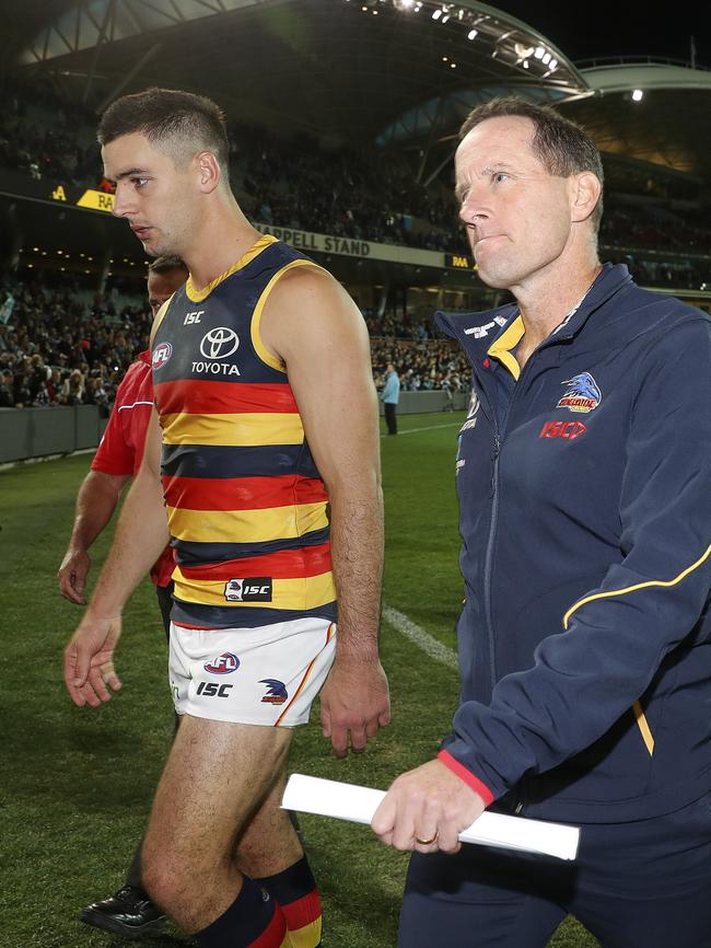 Taylor Walker and Don Pyke leave the oval after the Showdown loss. Picture Sarah Reed