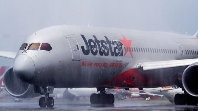 Jetstar Flight JQ49 – the inaugural direct flight to Seoul – gets the traditional water-cannon salute at Gold Coast Airport. Picture: Luke Marsden