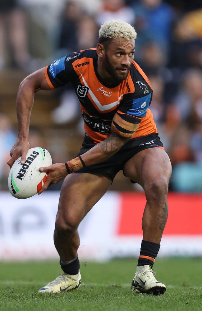 SYDNEY, AUSTRALIA - JUNE 15: Apisai Koroisau of the Wests Tigers passes the ball during the round 15 NRL match between Wests Tigers and Gold Coast Titans at Leichhardt Oval on June 15, 2024 in Sydney, Australia. (Photo by Jason McCawley/Getty Images)