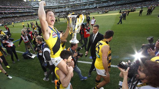 Daniel Rioli had to be carried — literally — through premiership celebrations after breaking his ankle. Picture: David Caird