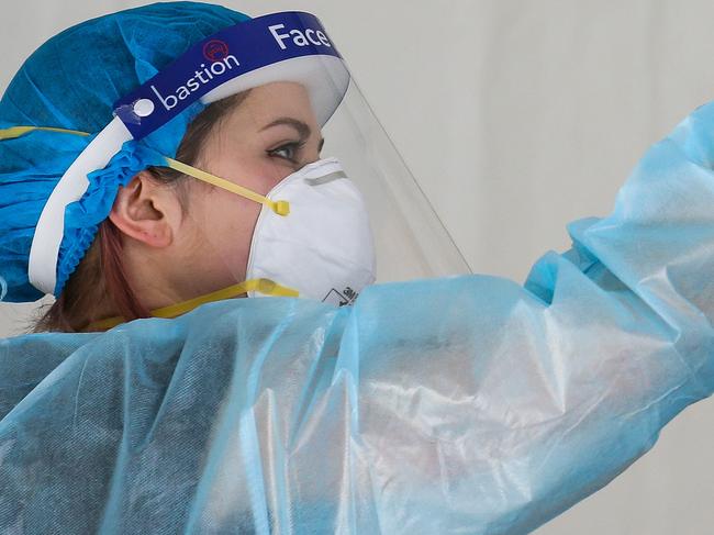 SYDNEY, AUSTRALIA - NewsWire Photos, AUGUST, 30, 2021: A Nurse is seen working at the Covid-19 pop up testing clinic in Auburn Town Centre.  South-west Sydney LGA areas remain under tight lockdown restrictions as the Covid-19 case numbers continue to rise in Sydney. Picture: NCA NewsWire/ Gaye Gerard