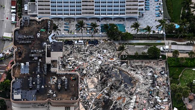 This aerial view, shows search and rescue personnel working on site after the partial collapse of the Champlain Towers South in Surfside, north of Miami Beach.