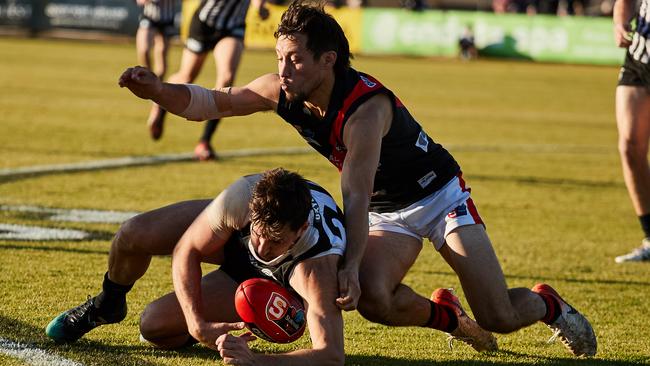 Port Adelaide’s Sam Mayes and West Adelaide’s Kaine Stevens fight for the ball at Alberton Oval. Picture: MATT LOXTON