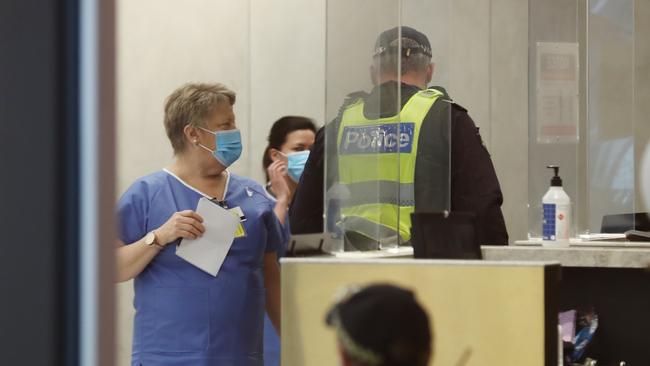 Victoria Police step in to guard the Novotel in Melbourne after issues with hotel quarantine Picture: David Crosling