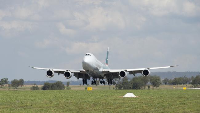 Cathay Pacific 747-8 jumbo cargo plane flys into Wellcamp Airport bound for Hong Kong, Monday, November 23, 2015. Photo Kevin Farmer / The Chronicle