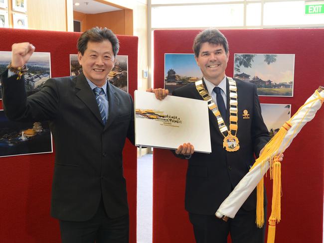 Wyong Mayor Doug Eaton (right) with Australia-Chinese Theme Park chief executive officer Bruce Zhong at last week’s launch of new plans for the Warnervale attraction.