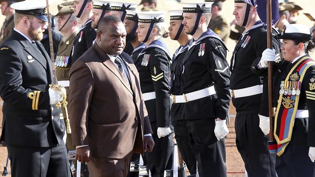 Papua New Guinea Prime Minister James Marape inspects troops as he is officially welcomed to Parliament House. Picture: AP