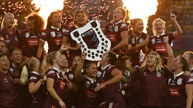 Queensland players celebrate with the shield after winning the 2023 Women’s State of Origin series. Picture: Getty Images